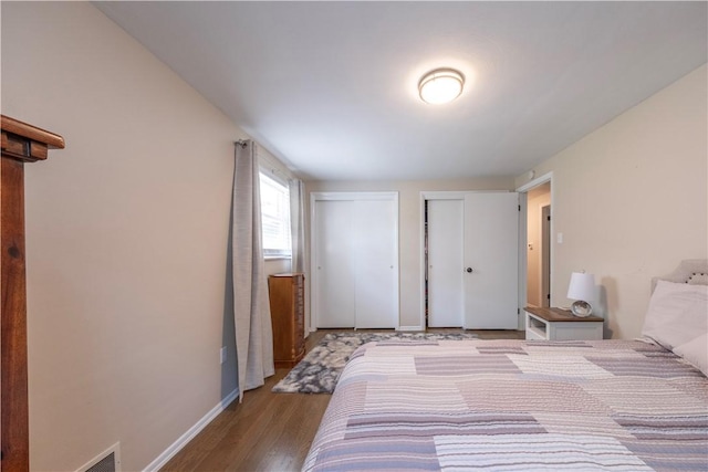 325 Clements Rd, Plum Boro, PA 15239 - bedroom with multiple closets and wood finished floors