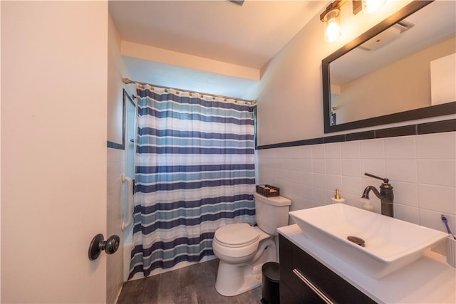 325 Clements Rd, Plum Boro, PA 15239 - bathroom featuring tile walls, vanity, wood finished floors, and curtained shower