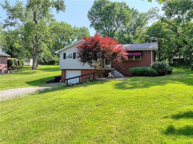 325 Clements Rd, Plum Boro, PA 15239 - view of front facade featuring an attached garage, a front yard, and brick siding