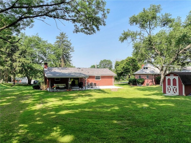 325 Clements Rd, Plum Boro, PA 15239 - view of grassy yard featuring a patio area and a shed