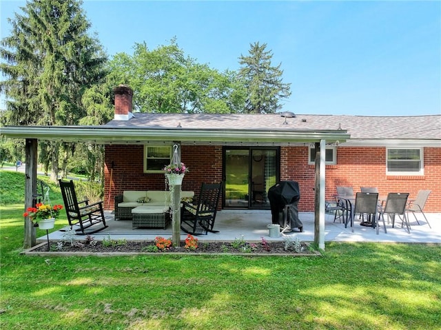 325 Clements Rd, Plum Boro, PA 15239 - rear view of property with brick siding, a lawn, and a chimney