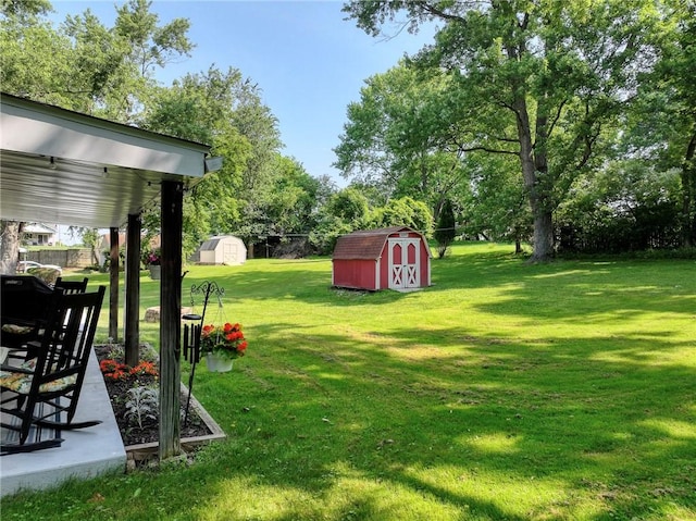 325 Clements Rd, Plum Boro, PA 15239 - view of green lawn with a shed and view of wooded area