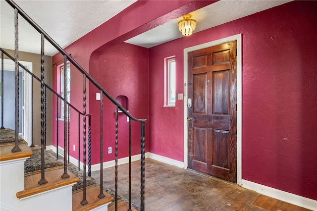 1000 Prospect Rd, Whitehall, PA 15227 - foyer entrance with a textured wall, stairway, and wood finished floors