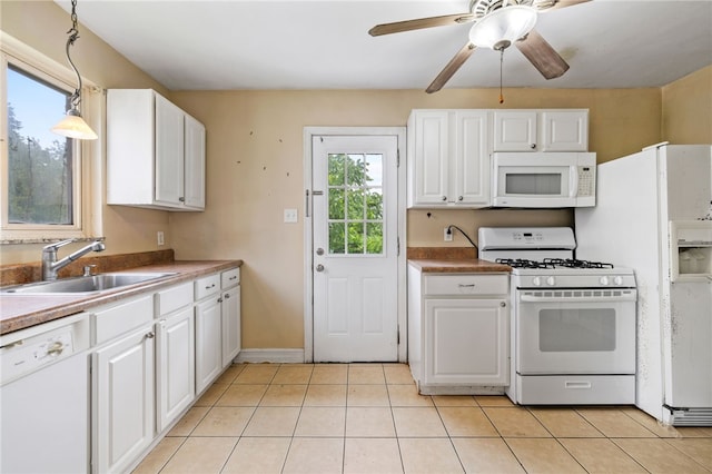 1000 Prospect Rd, Whitehall, PA 15227 - kitchen with white appliances, white cabinets, and light tile patterned flooring