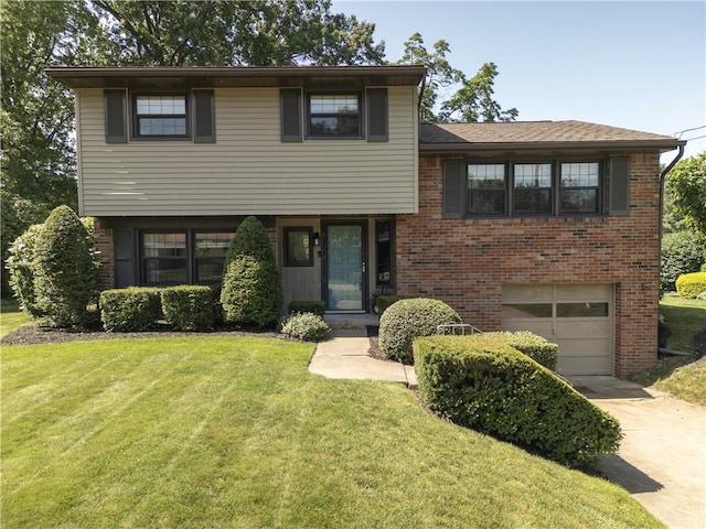 202 Lytton Rd, Moon/Crescent Twp, PA 15108 - tri-level home with a garage, concrete driveway, a front lawn, and brick siding