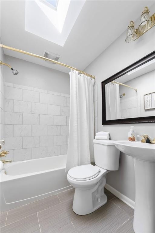 202 Lytton Rd, Moon/Crescent Twp, PA 15108 - bathroom featuring shower / bath combo with shower curtain and a skylight