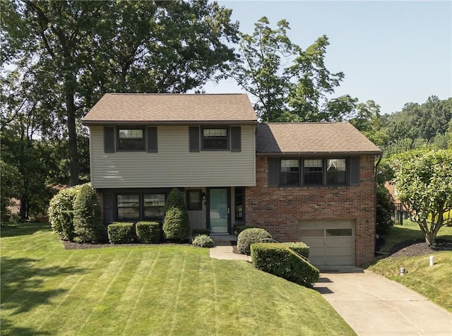 202 Lytton Rd, Moon/Crescent Twp, PA 15108 - split level home featuring an attached garage, concrete driveway, a front yard, brick siding, and roof with shingles