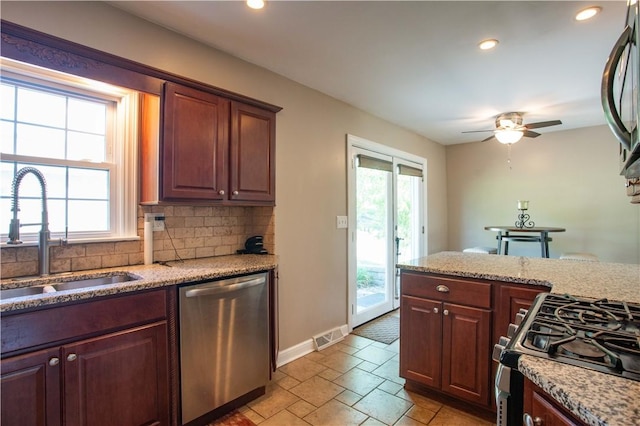 101 Lynne Dr, Big Beaver, PA 15010 - kitchen with appliances with stainless steel finishes, decorative backsplash, a ceiling fan, light stone countertops, and recessed lighting