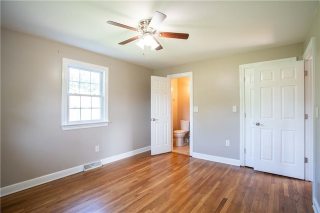 101 Lynne Dr, Big Beaver, PA 15010 - unfurnished bedroom with wood finished floors, ensuite bathroom, and ceiling fan