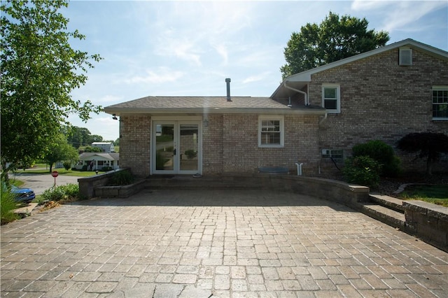 101 Lynne Dr, Big Beaver, PA 15010 - back of property with brick siding and french doors