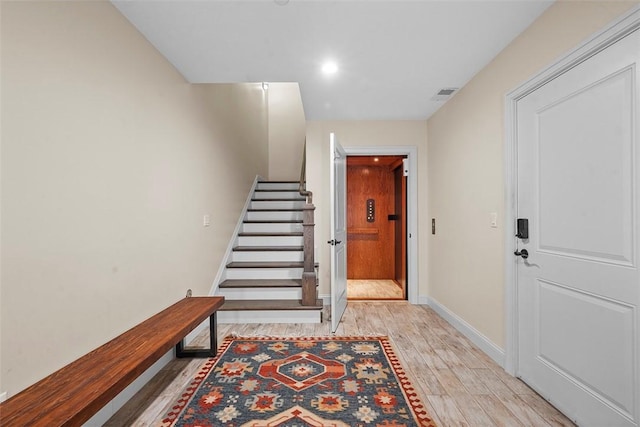246 42nd St, Lawrenceville, PA 15201 - staircase with wood finished floors and recessed lighting