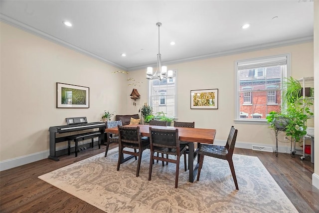 246 42nd St, Lawrenceville, PA 15201 - dining area featuring a chandelier, crown molding, dark wood-style floors, and recessed lighting