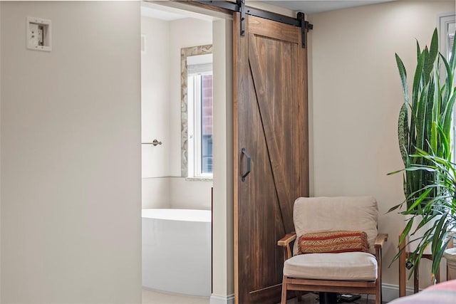 246 42nd St, Lawrenceville, PA 15201 - sitting room featuring a barn door and plenty of natural light