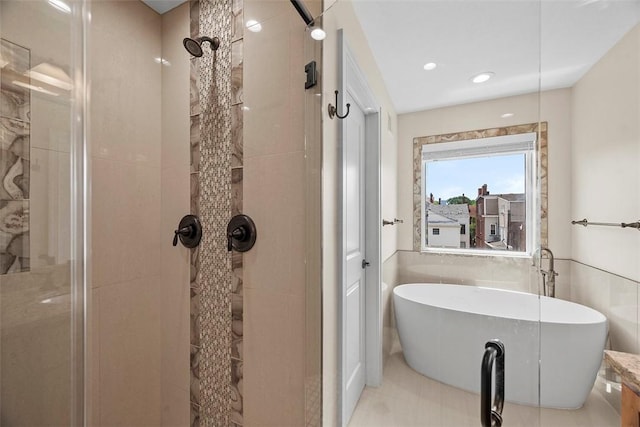 246 42nd St, Lawrenceville, PA 15201 - full bath with a stall shower, a soaking tub, and tile walls