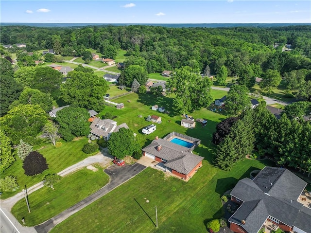 aerial overview of property's location featuring a heavily wooded area
