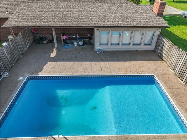 view of pool with a patio and a fenced backyard