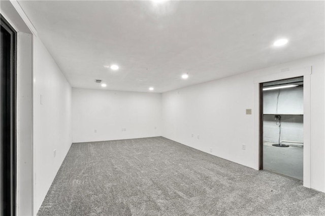 carpeted spare room with recessed lighting