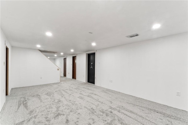 finished below grade area featuring recessed lighting and carpet