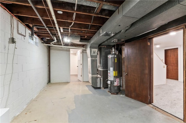 unfinished below grade area featuring water heater, heating unit, and concrete block wall