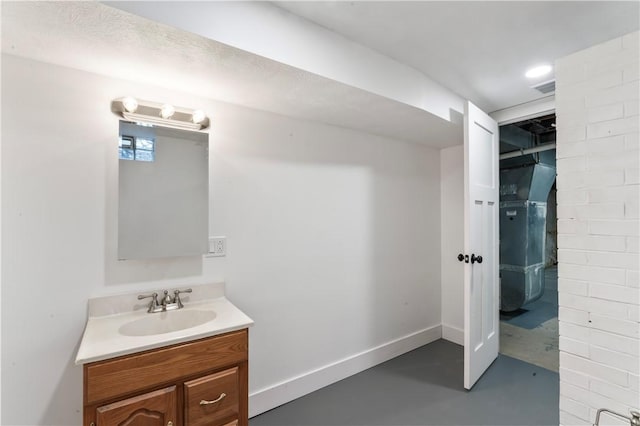 bathroom with finished concrete flooring and vanity