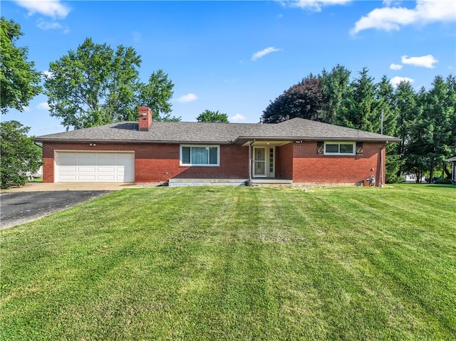 ranch-style home featuring brick siding, a garage, a chimney, and driveway