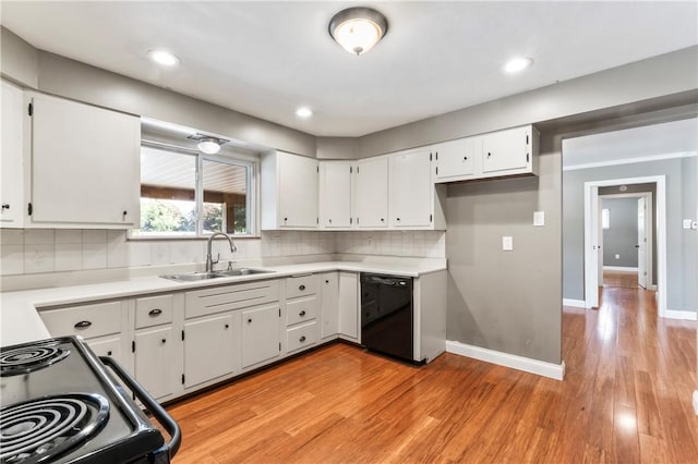 kitchen featuring black appliances, white cabinets, light wood-type flooring, light countertops, and recessed lighting