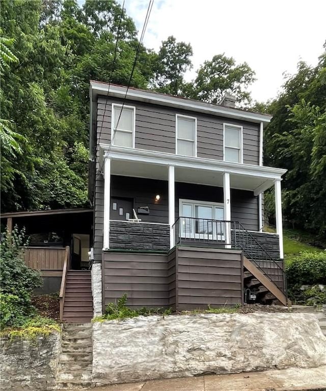 7 Prospect St, Etna, PA 15223 - view of front of house with stairway, covered porch, and a chimney