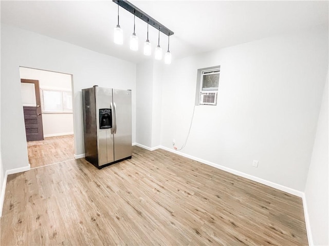 7 Prospect St, Etna, PA 15223 - kitchen featuring stainless steel fridge with ice dispenser, light wood finished floors, and hanging light fixtures