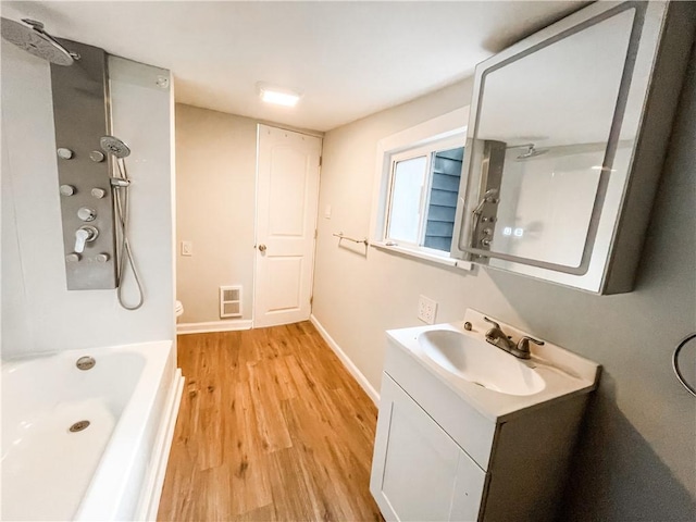 7 Prospect St, Etna, PA 15223 - bathroom with vanity, wood finished floors, and shower / bathtub combination