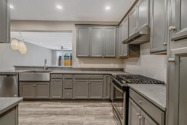 441 Roebling Ct, Cranberry Twp, PA 16066 - kitchen with gray cabinetry, stainless steel appliances, under cabinet range hood, recessed lighting, and backsplash