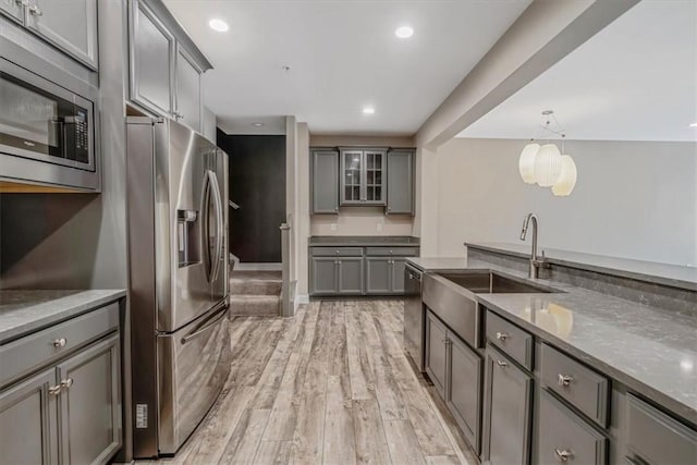 441 Roebling Ct, Cranberry Twp, PA 16066 - kitchen featuring gray cabinets, stainless steel appliances, light wood-type flooring, glass insert cabinets, and recessed lighting