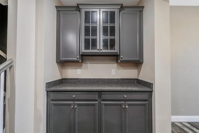 441 Roebling Ct, Cranberry Twp, PA 16066 - kitchen with gray cabinetry, dark countertops, and glass insert cabinets