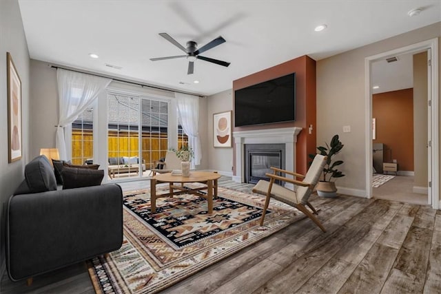441 Roebling Ct, Cranberry Twp, PA 16066 - living area with ceiling fan, a glass covered fireplace, wood finished floors, and recessed lighting