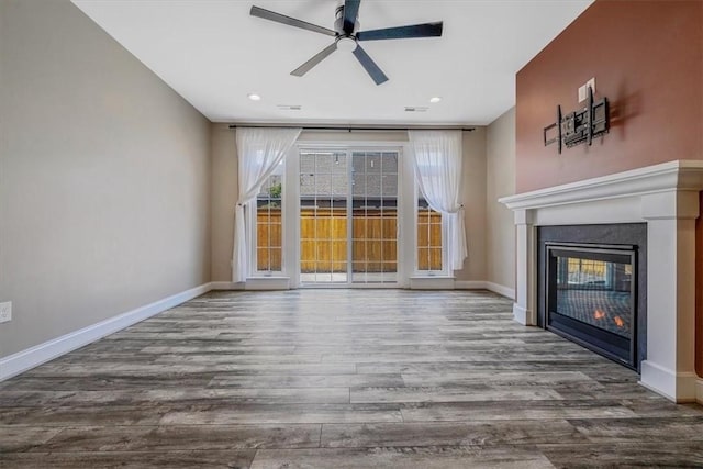441 Roebling Ct, Cranberry Twp, PA 16066 - unfurnished living room with ceiling fan, wood finished floors, a glass covered fireplace, and recessed lighting