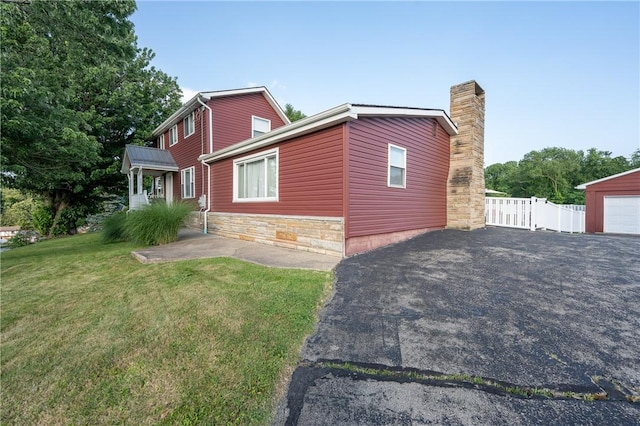 563 Edward St, Derry Twp, PA 15650 - view of property exterior featuring a chimney
