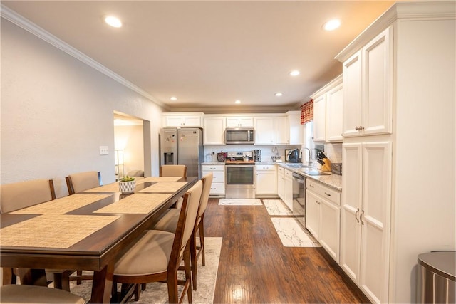 563 Edward St, Derry Twp, PA 15650 - kitchen with appliances with stainless steel finishes, crown molding, dark wood-style floors, recessed lighting, and white cabinets