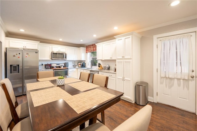 563 Edward St, Derry Twp, PA 15650 - dining area with ornamental molding, dark wood finished floors, and recessed lighting