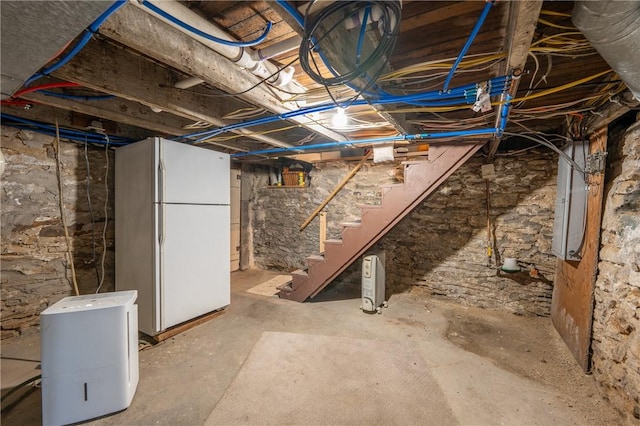 563 Edward St, Derry Twp, PA 15650 - unfinished below grade area with freestanding refrigerator and stairs