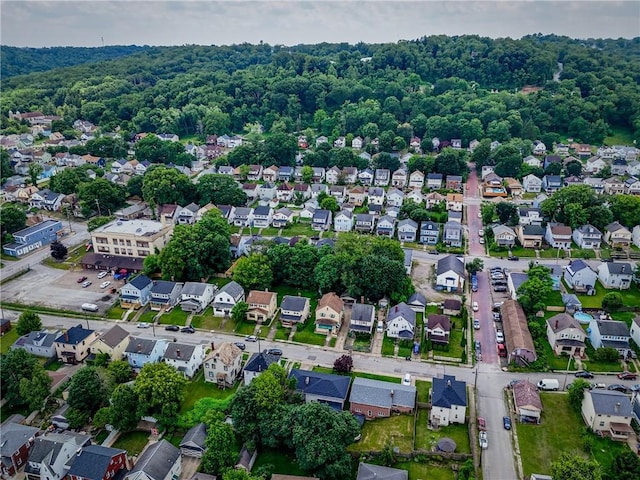 1220 Mcminn St, Aliquippa, PA 15001 - aerial view of property's location with nearby suburban area and a heavily wooded area