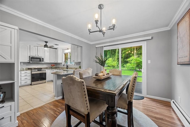 124 Heath Dr, Economy, PA 15005 - dining room with a baseboard heating unit, light wood finished floors, ornamental molding, a chandelier, and ceiling fan