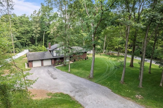124 Heath Dr, Economy, PA 15005 - view of front of house featuring dirt driveway, a front lawn, a chimney, an attached garage, and brick siding