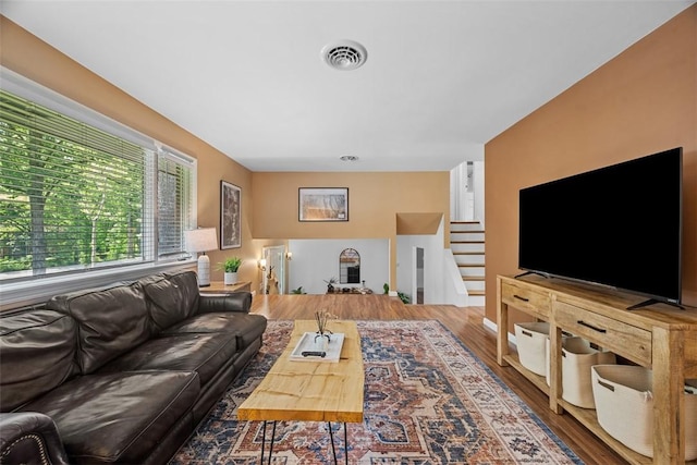 124 Heath Dr, Economy, PA 15005 - living room featuring stairway and wood finished floors