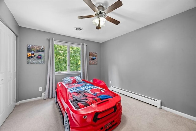 124 Heath Dr, Economy, PA 15005 - bedroom with baseboard heating, carpet floors, a closet, and ceiling fan