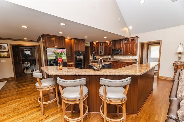 391 Browns Hill Rd, Middlesex Twp, PA 16059 - kitchen with stainless steel appliances, a large island, recessed lighting, lofted ceiling, and glass insert cabinets