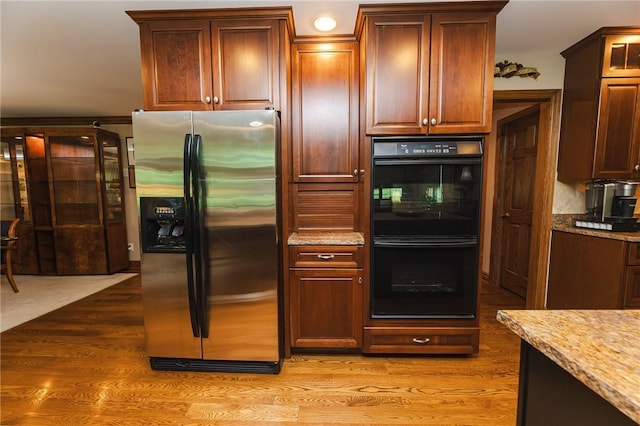 391 Browns Hill Rd, Middlesex Twp, PA 16059 - kitchen with stainless steel fridge, light wood-style floors, and light stone countertops