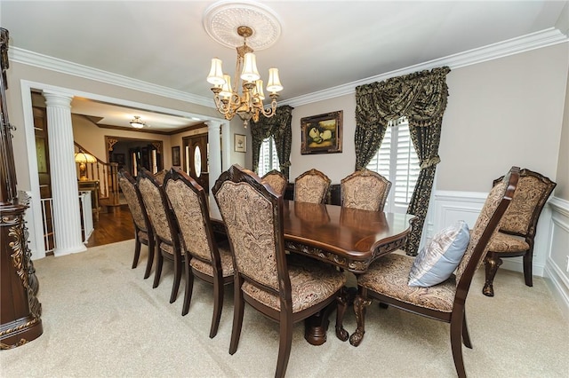391 Browns Hill Rd, Middlesex Twp, PA 16059 - dining area featuring decorative columns, a chandelier, light carpet, crown molding, and a wainscoted wall