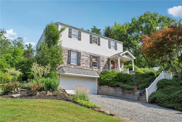 105 Gary Dr, Ohio Twp, PA 15143 - view of front of home with gravel driveway, stairway, a garage, and a front yard