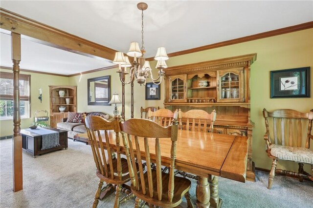 105 Gary Dr, Ohio Twp, PA 15143 - dining space with light carpet, a chandelier, and crown molding