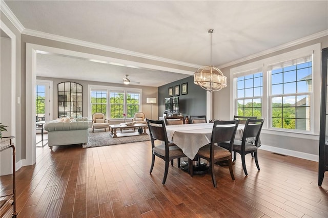 1735 Stevensan Dr, Franklin Park, PA 15143 - dining room featuring ornamental molding, dark wood-type flooring, plenty of natural light, and a chandelier