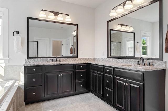 1735 Stevensan Dr, Franklin Park, PA 15143 - full bathroom with double vanity, tile patterned flooring, a relaxing tiled tub, and a shower